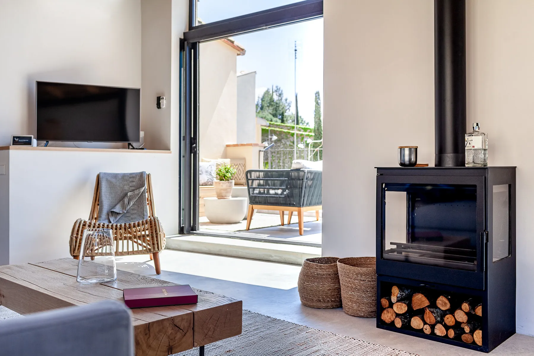 Wood-burning stove beside doors opening onto the roof terrace
