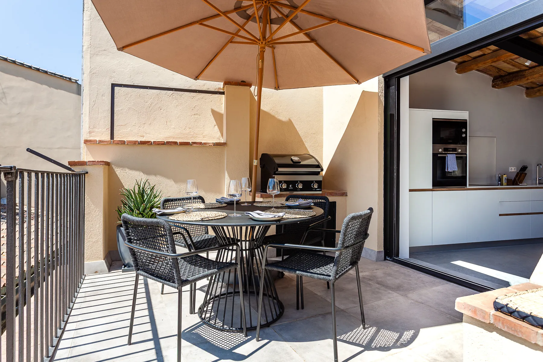 Roof terrace barbecue and dining area opening off the kitchen