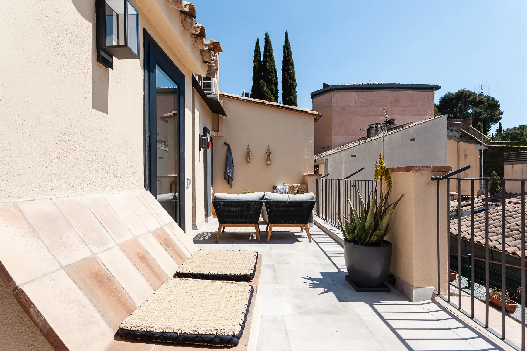 Sun loungers and planting on the roof terrace, overlooking the old town